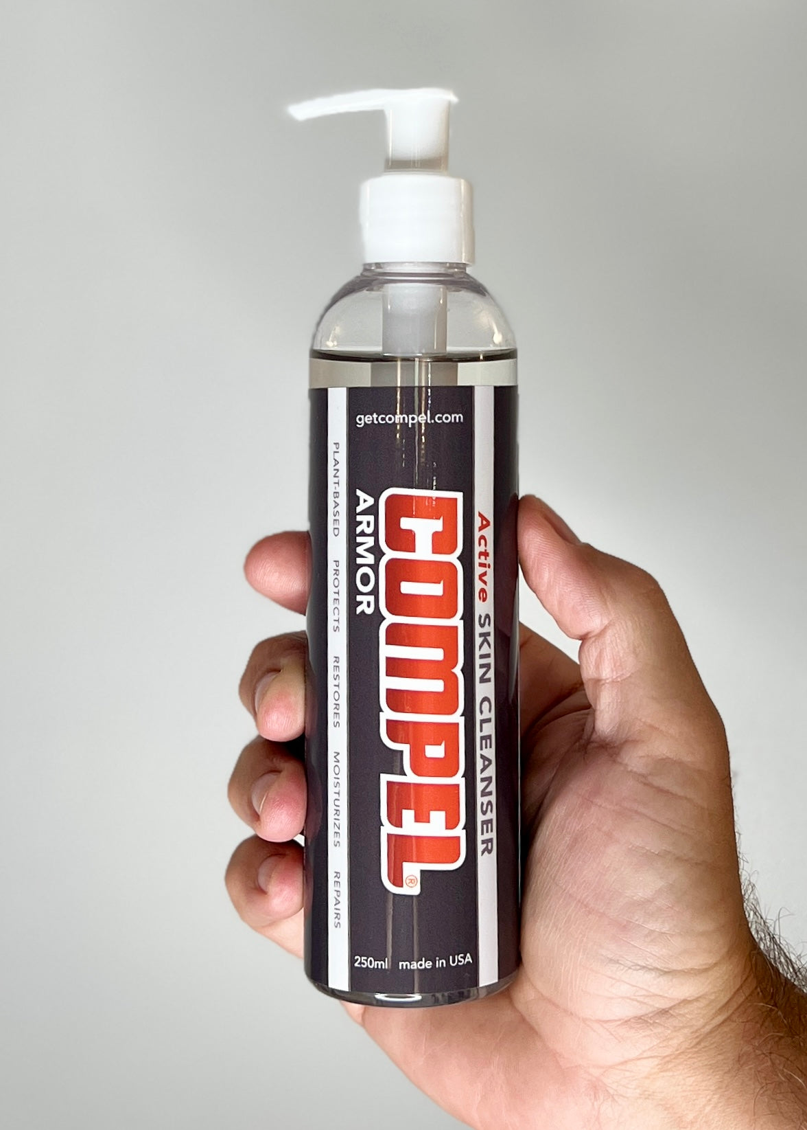 COMPEL ARMOR 250 mL pump bottle at a gym front desk